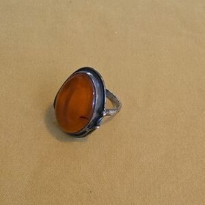 Amber Cabochon Ring Set in a vintage-style silver mounting (Unmarked)
